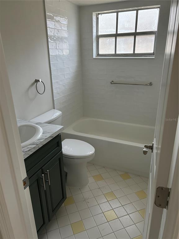 4422 Sunstate Drive New Port Richey, FL 34652 - Photo 14 of 19 a bathroom with a sink a toilet and shower