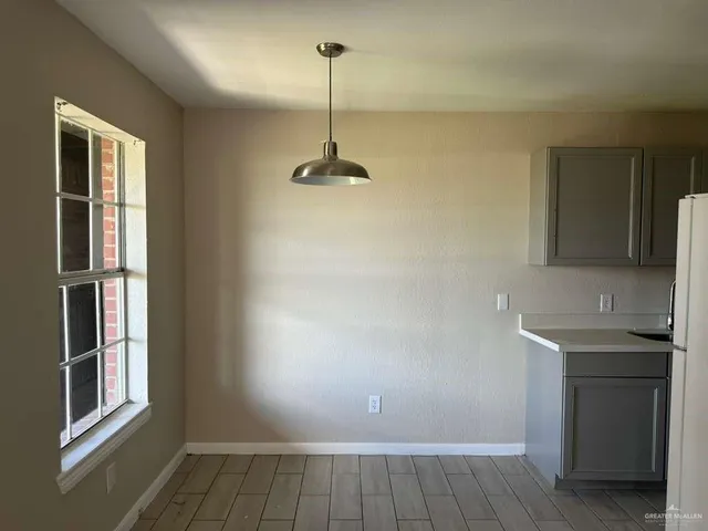a view of a kitchen from the hallway