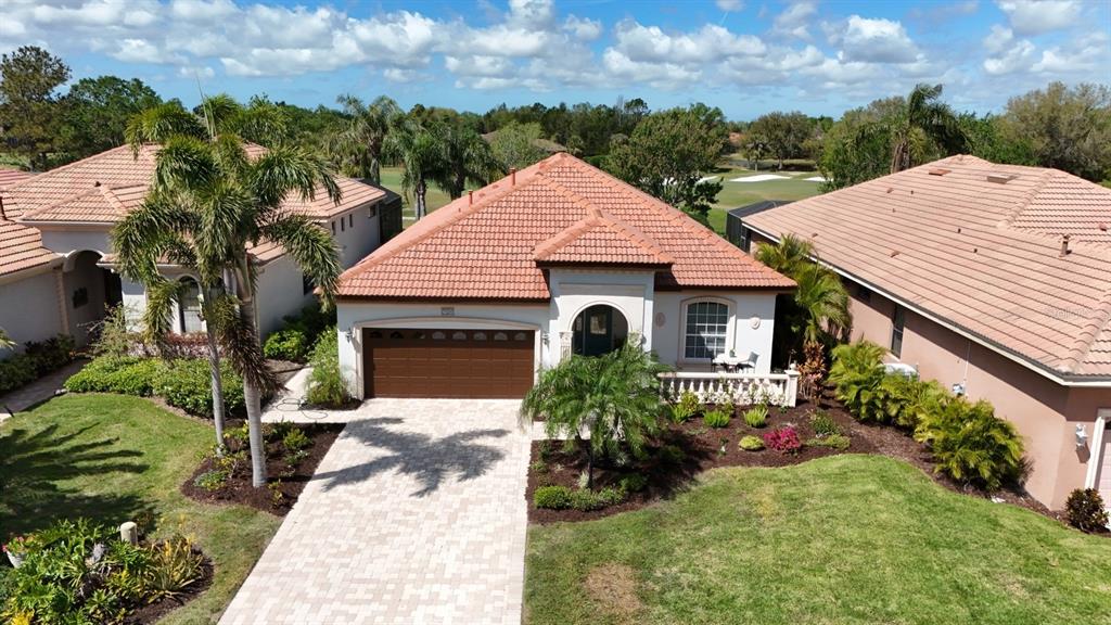 7324 Riviera Cove Lakewood Ranch, FL 34202 - Photo 1 of 1 a front view of a house with garden