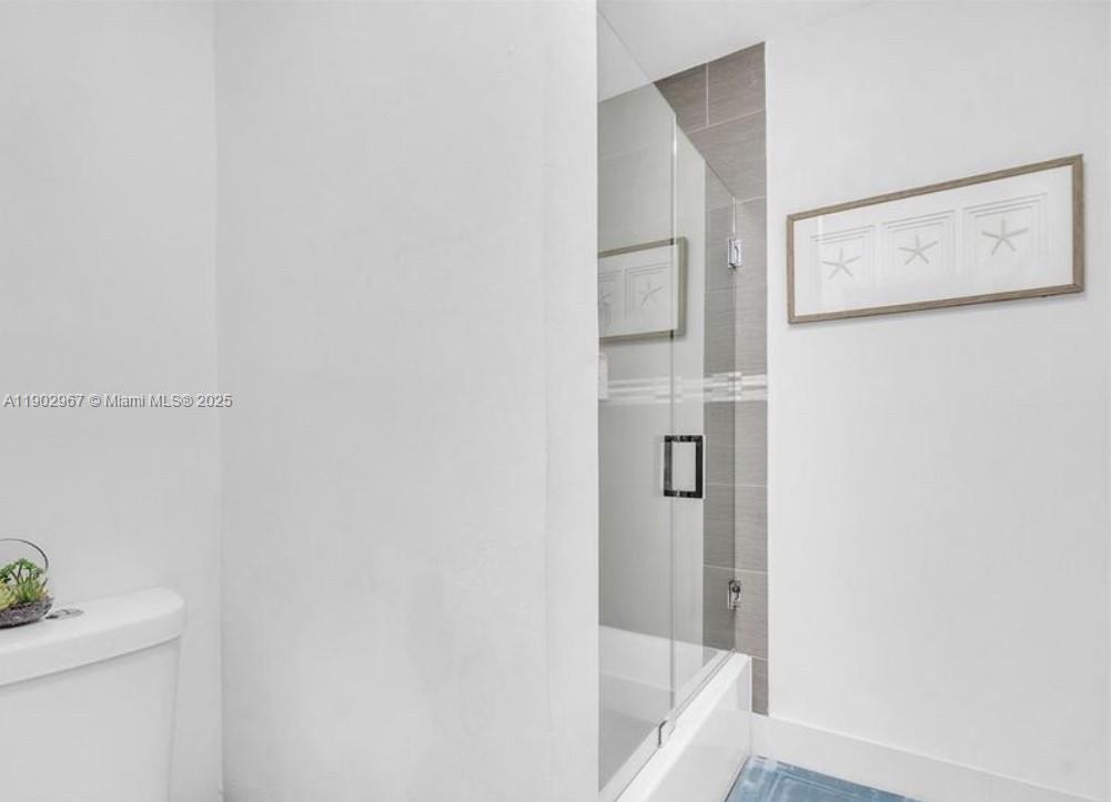 16891 Southwest 277th Street Homestead, FL 33031 - Photo 19 of 47 a bathroom with a bathtub and shower