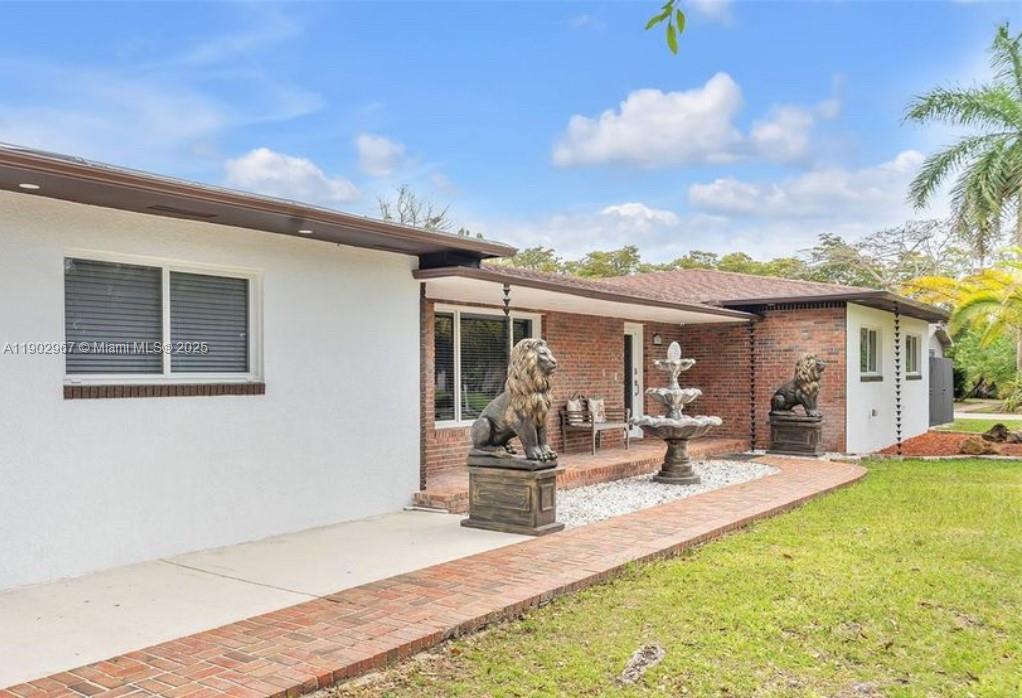 16891 Southwest 277th Street Homestead, FL 33031 - Photo 2 of 47 a view of a house with backyard porch and patio