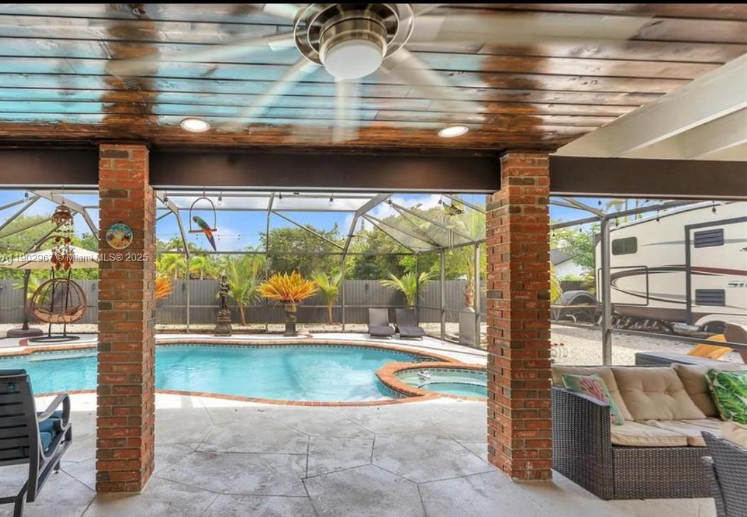 16891 Southwest 277th Street Homestead, FL 33031 - Photo 24 of 47 a view of a swimming pool and outdoor space