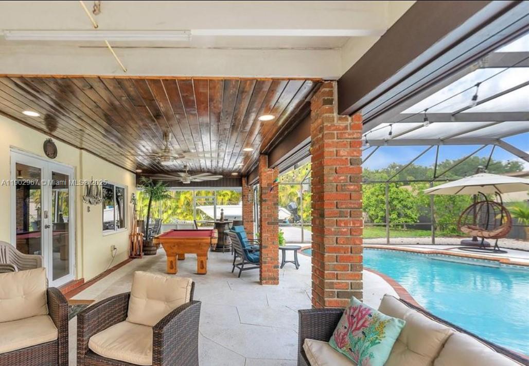 16891 Southwest 277th Street Homestead, FL 33031 - Photo 26 of 47 a living room with furniture and a large window