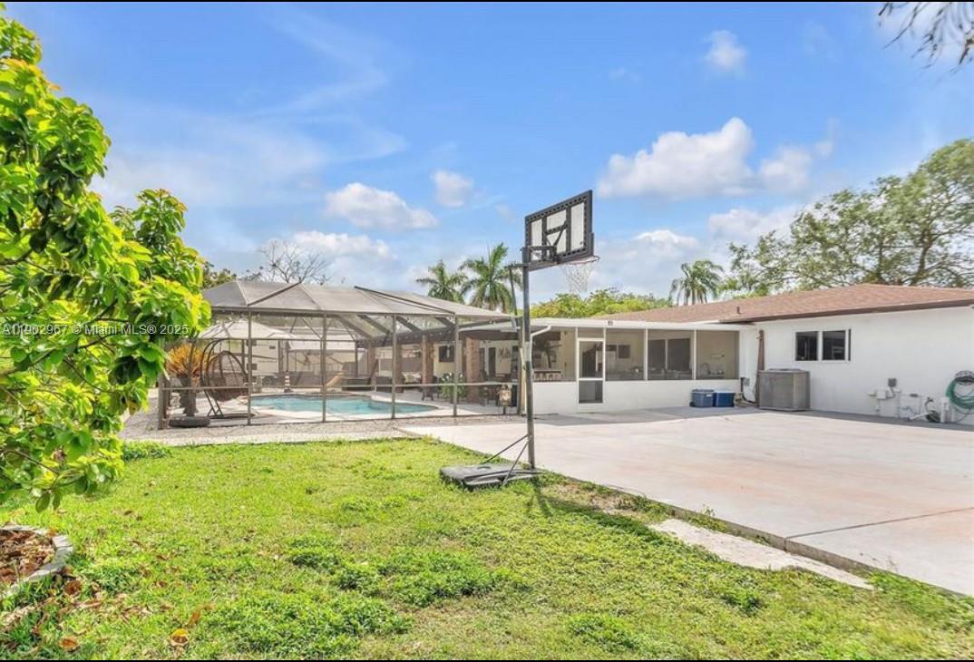 16891 Southwest 277th Street Homestead, FL 33031 - Photo 41 of 47 a front view of a house with a yard table and chairs