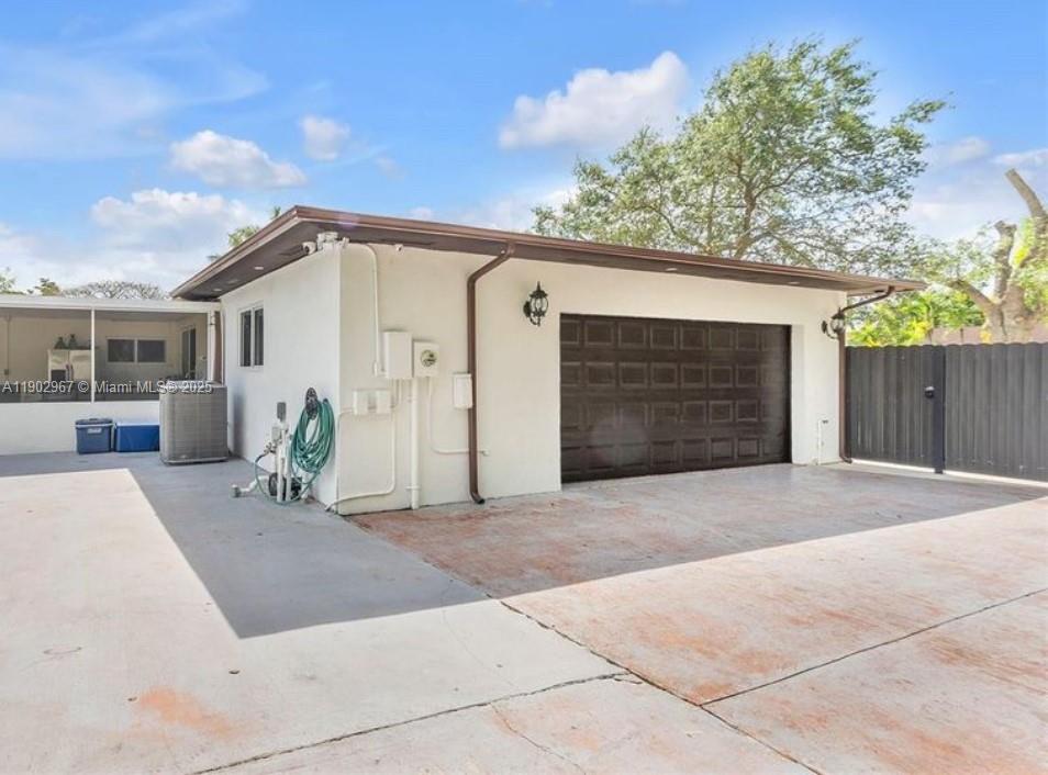 16891 Southwest 277th Street Homestead, FL 33031 - Photo 46 of 47 a front view of a house with a yard and garage