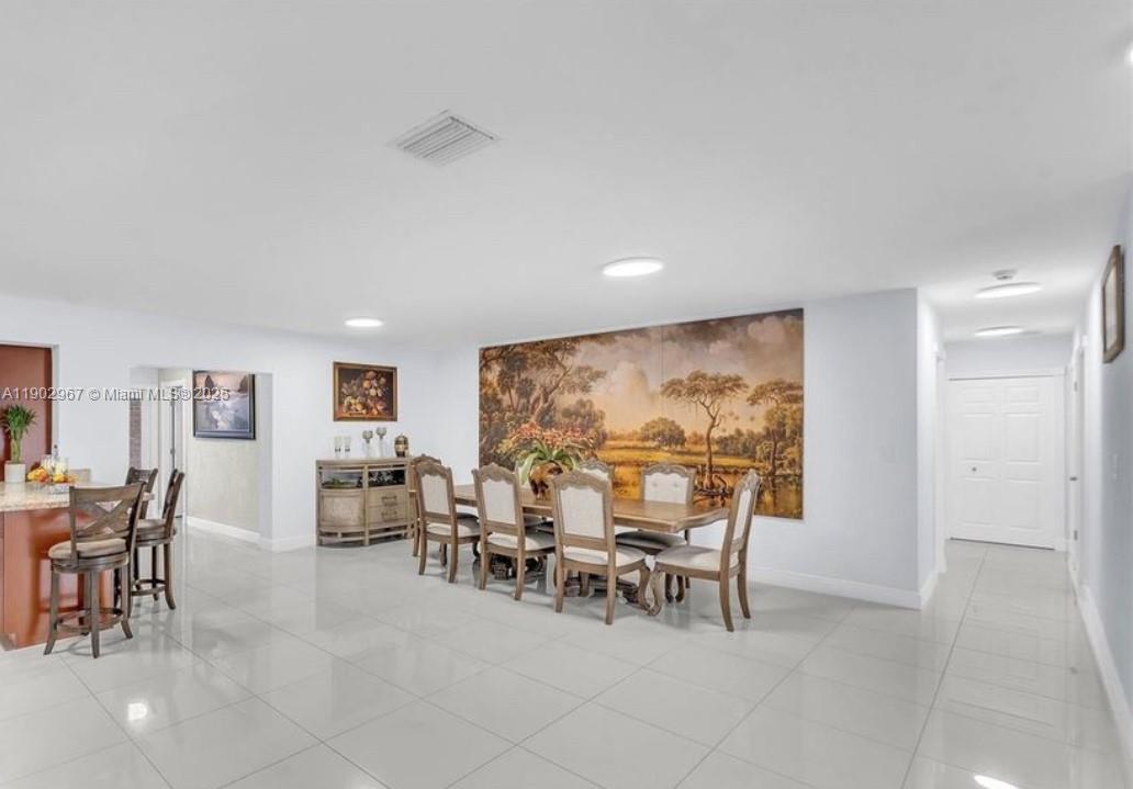 16891 Southwest 277th Street Homestead, FL 33031 - Photo 8 of 47 a view of a livingroom with furniture and chandelier