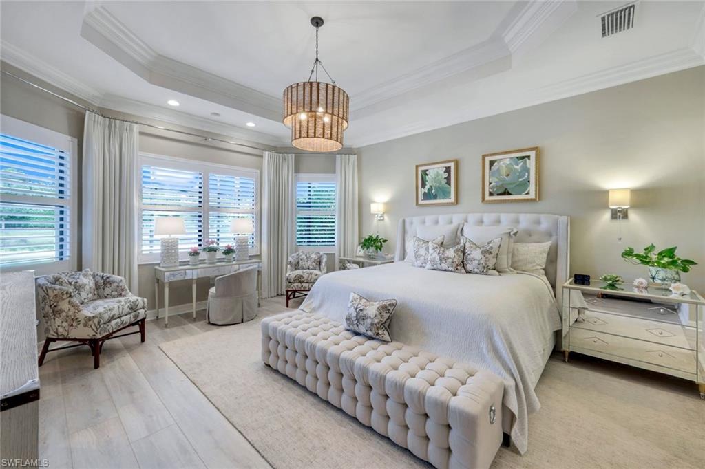 4478 Caldera Circle Naples, FL 34119 - Photo 19 of 50 Soothing Primary Suite with views of the landscapes and lake beyond