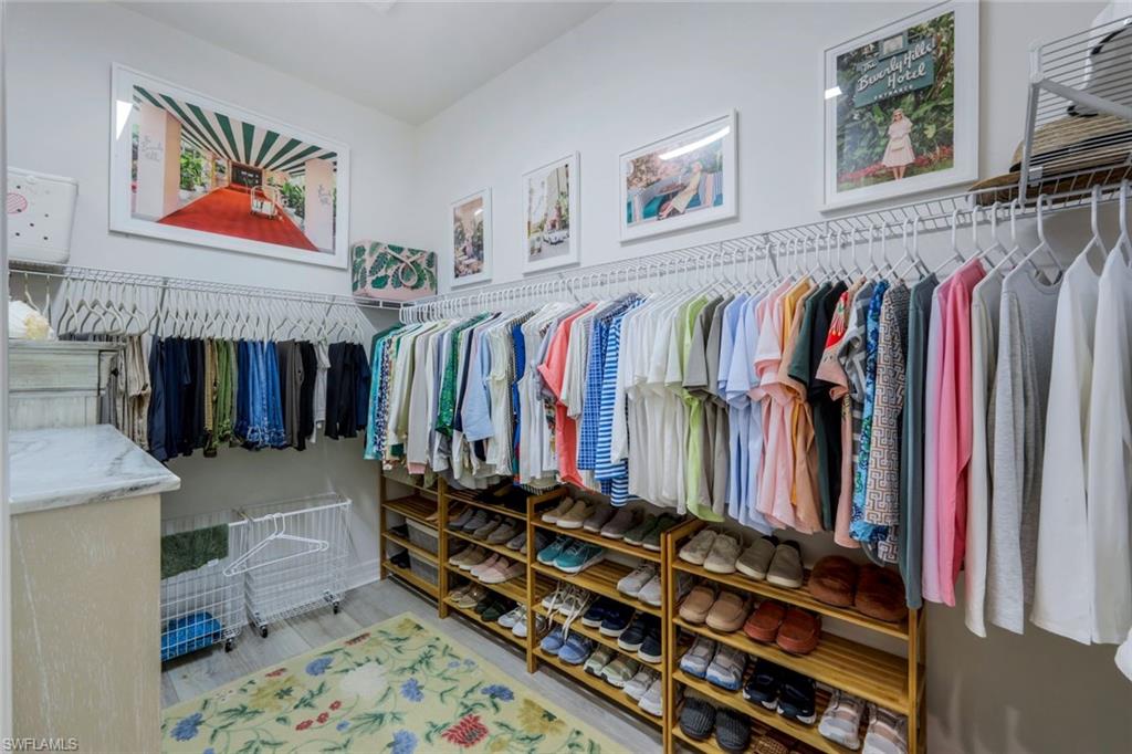4478 Caldera Circle Naples, FL 34119 - Photo 26 of 50 Two nice closets are located between the Bedroom and Bath