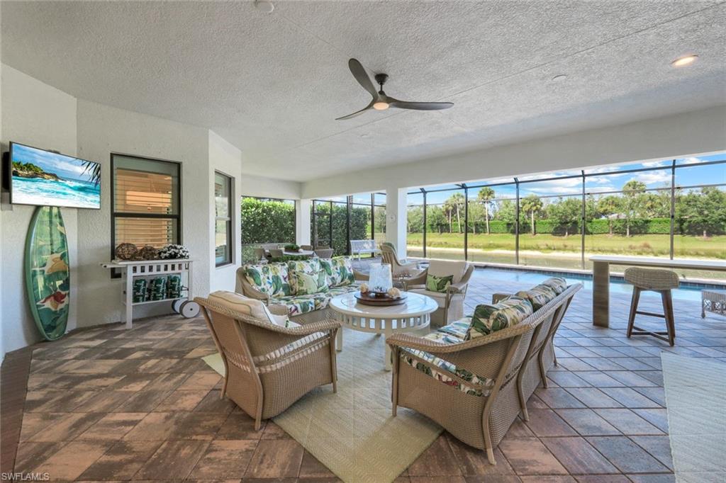 4478 Caldera Circle Naples, FL 34119 - Photo 31 of 50 Watch the game, take a dip in the pool, read a book beside the lake, what a life!
