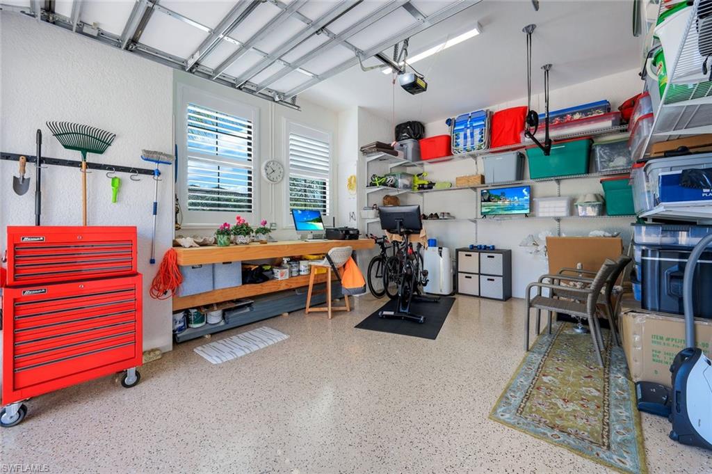4478 Caldera Circle Naples, FL 34119 - Photo 41 of 50 The 3rd Garage Bay with epoxy floor is separate with air conditioning and can be used for hobbies, storage, tools, or of course, a Car!