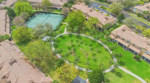 an aerial view of residential houses with outdoor space