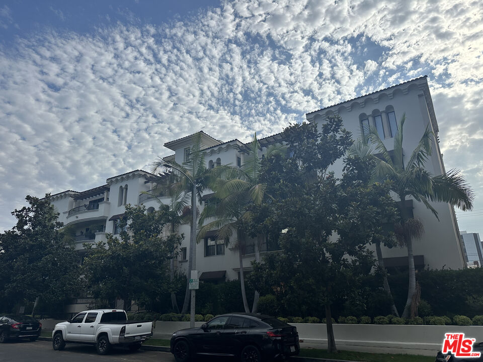 a view of road with building and trees