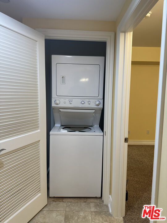 122 North Clark Drive, Unit 105 West Hollywood, CA 90048 - Photo 17 of 28 a utility room with dryer and washer