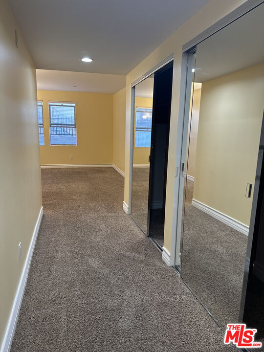 122 North Clark Drive, Unit 105 West Hollywood, CA 90048 - Photo 24 of 28 an empty room with entrance and door