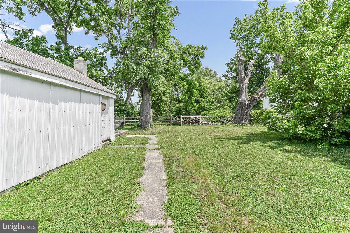 1019 Riverside Drive Pottstown, PA 19465 - Photo 33 of 36 Spacious yard with lush greenery.