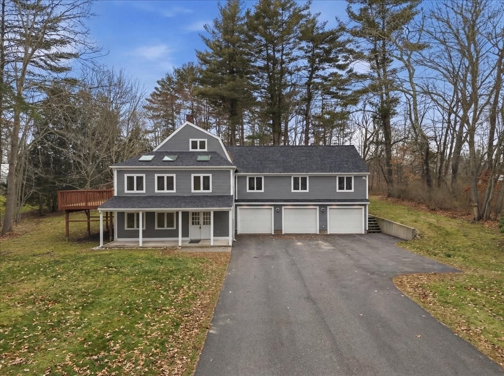98 Walnut Street Halifax, MA 02338 - Photo 1 of 36 a front view of a house with a yard and large trees