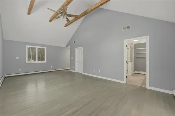 a view of an empty room with a window