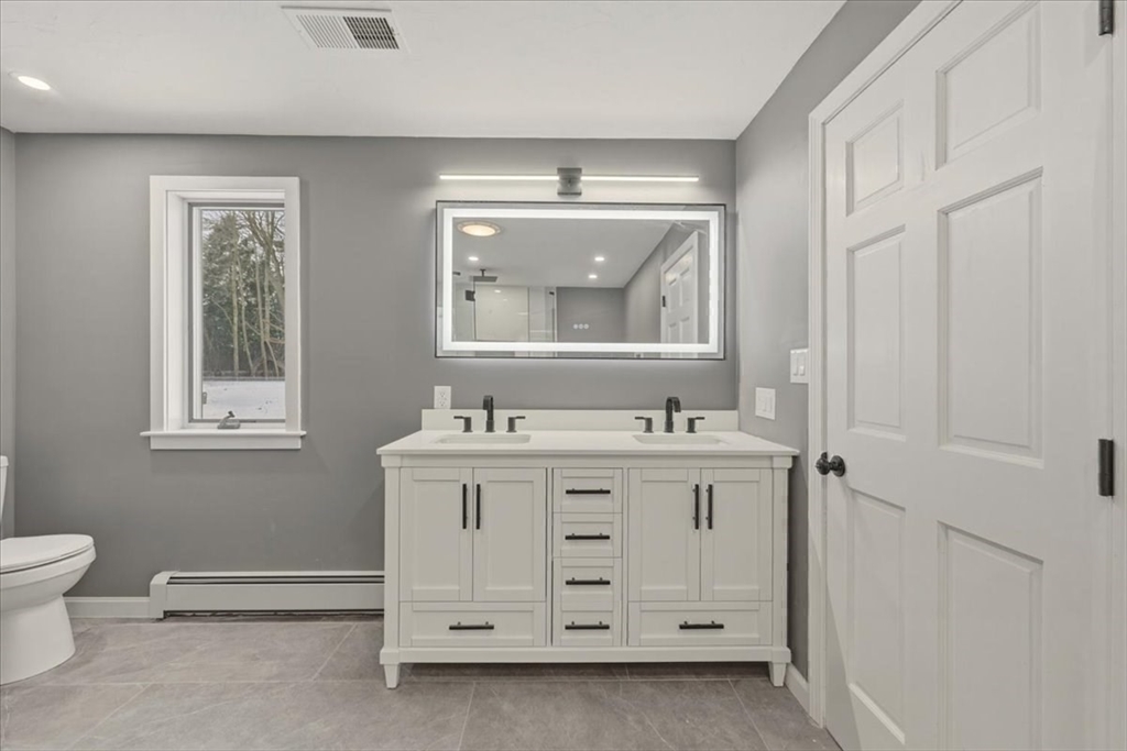 98 Walnut Street Halifax, MA 02338 - Photo 24 of 36 a bathroom with a sink vanity and a mirror