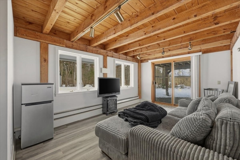 98 Walnut Street Halifax, MA 02338 - Photo 25 of 36 a living room with furniture and a flat screen tv