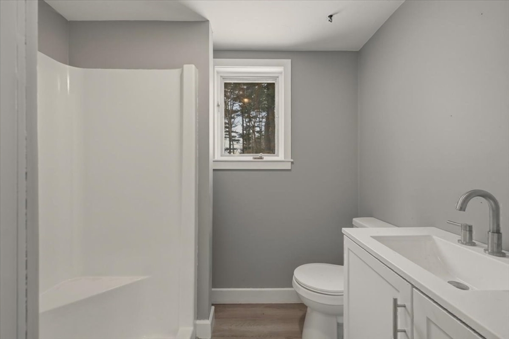 98 Walnut Street Halifax, MA 02338 - Photo 26 of 36 a white toilet sitting next to a bathroom sink