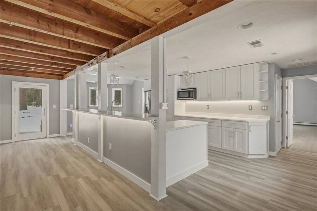98 Walnut Street Halifax, MA 02338 - Photo 3 of 36 a kitchen with white cabinets and white appliances