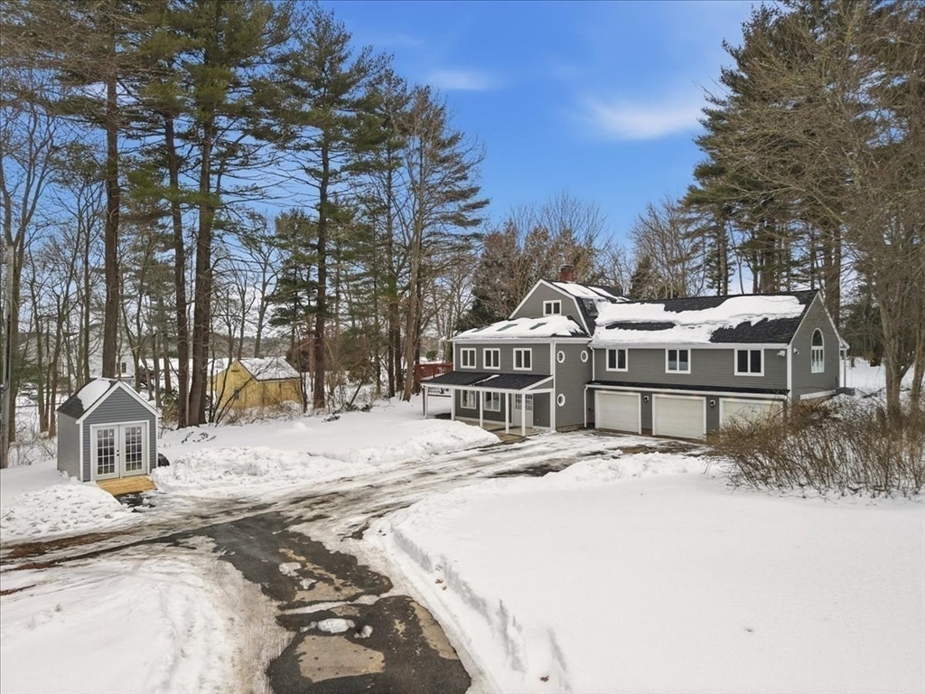 98 Walnut Street Halifax, MA 02338 - Photo 34 of 36 a house with trees in front of it