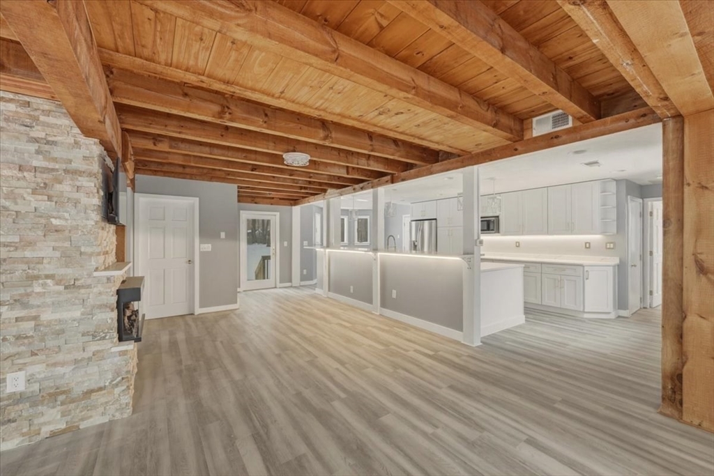 98 Walnut Street Halifax, MA 02338 - Photo 6 of 36 a view of a porch with wooden floor and fence