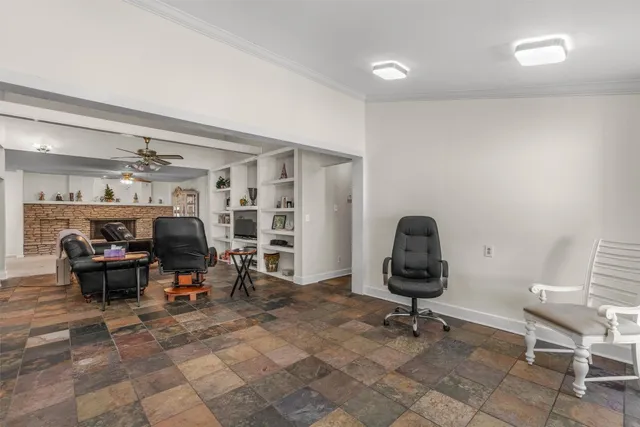 a living room with furniture and a chair