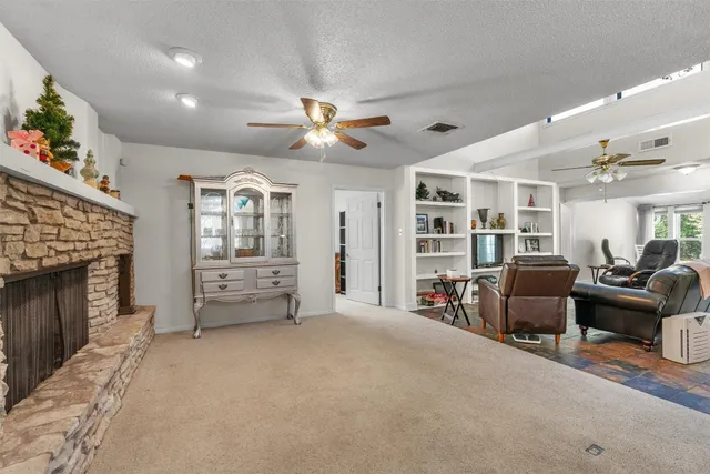 a living room with furniture and a fireplace