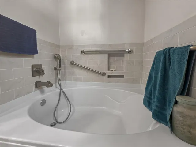 a bathroom with a shower and a shower