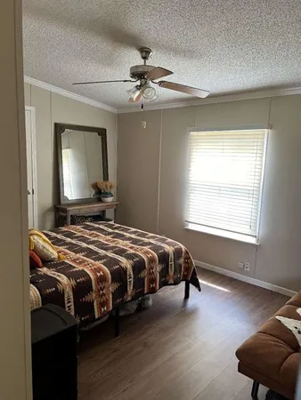 a bedroom with bed and window