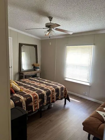 a bedroom with bed and window