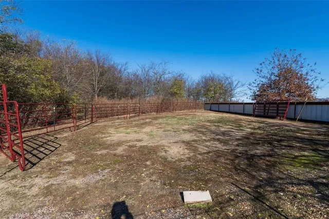 a view of a backyard of the house