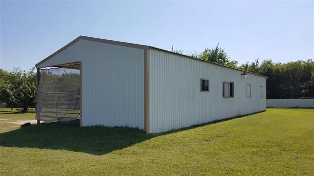 a backyard of a house with lots of green space