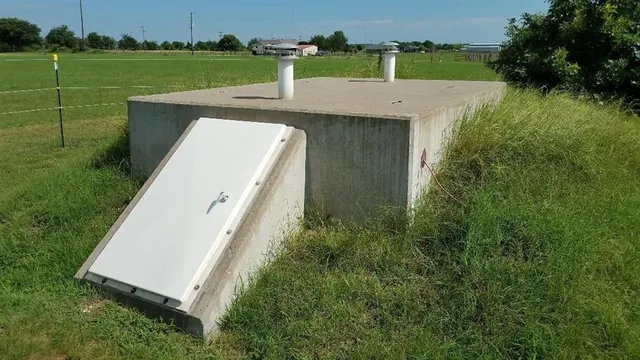 an aerial view of a house with a yard basket ball court and outdoor seating