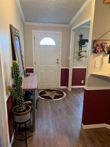 a room with furniture and wooden floor