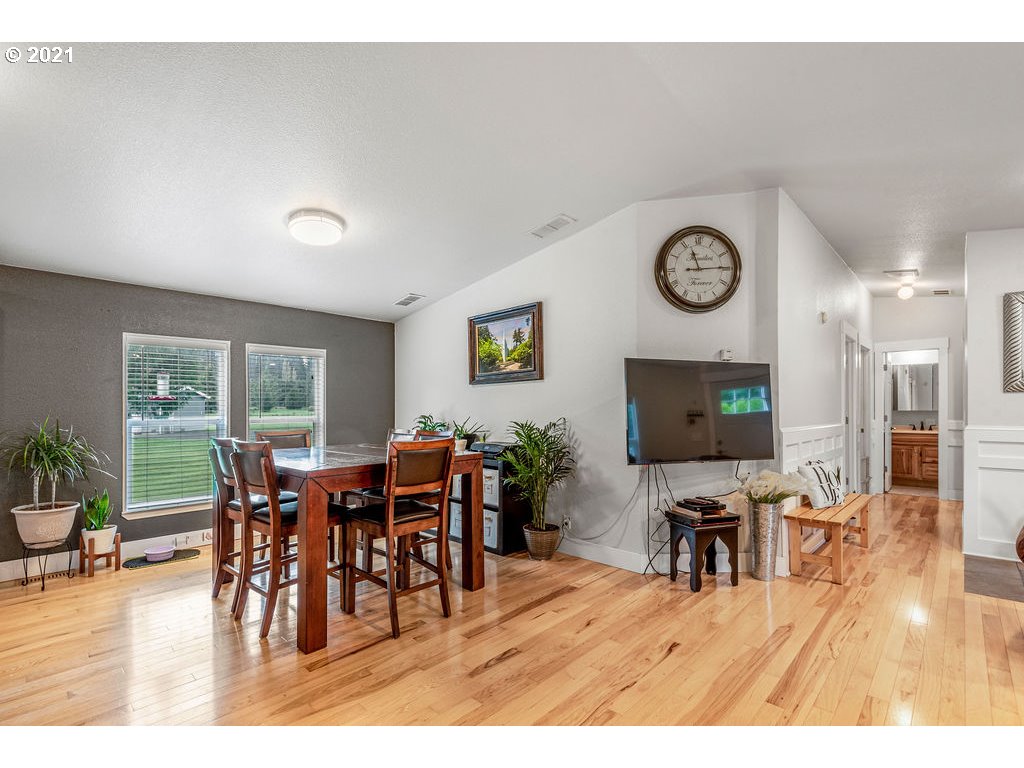 109 Highland Road Winlock, WA 98596 - Photo 15 of 28 a view of a dining room with furniture window and wooden floor