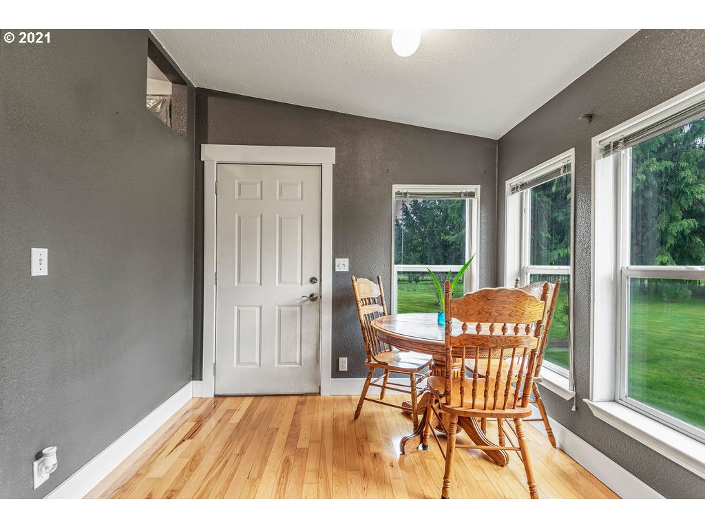109 Highland Road Winlock, WA 98596 - Photo 20 of 28 a dining room with furniture and wooden floor
