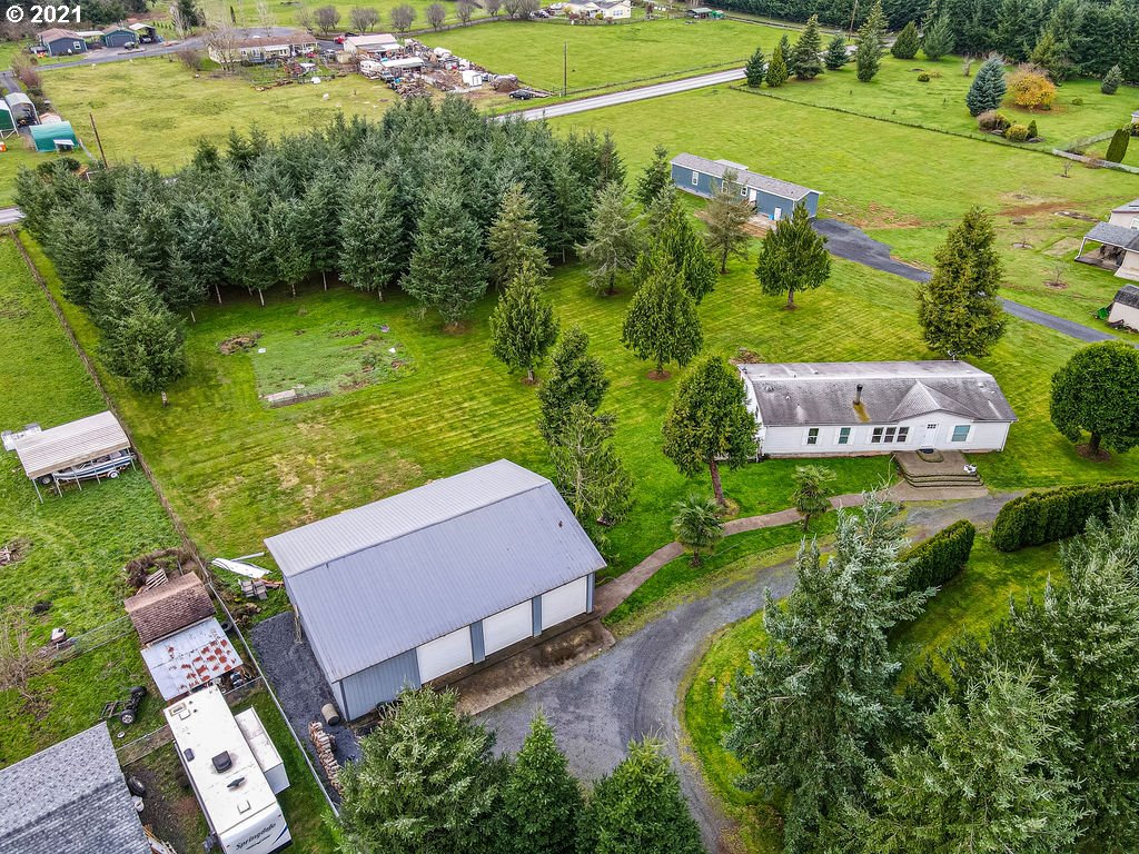 109 Highland Road Winlock, WA 98596 - Photo 2 of 28 an aerial view of a house with yard swimming pool and outdoor seating