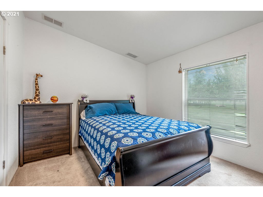 109 Highland Road Winlock, WA 98596 - Photo 23 of 28 a bedroom with a bed and window