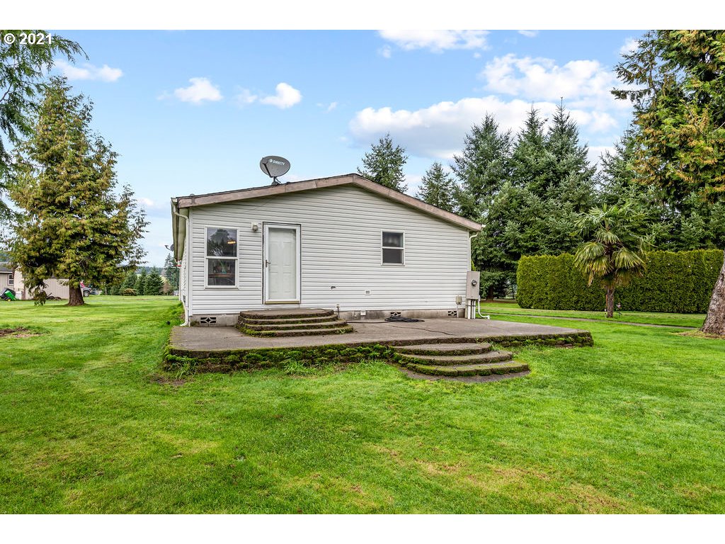109 Highland Road Winlock, WA 98596 - Photo 6 of 28 a view of a house with a backyard