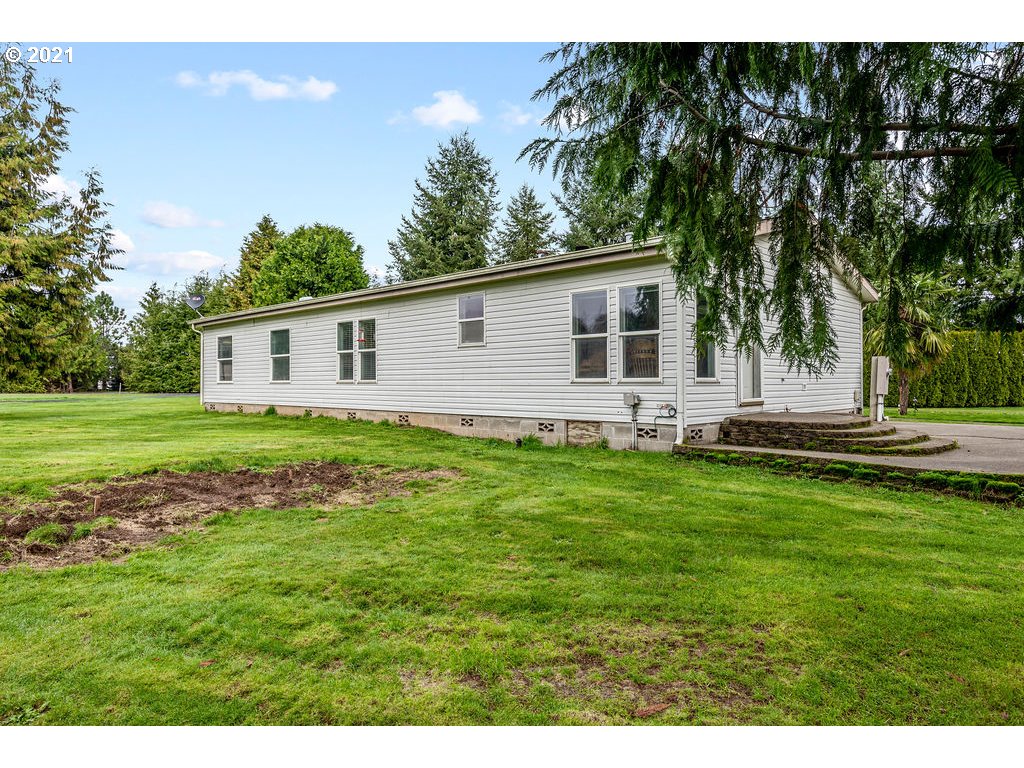 109 Highland Road Winlock, WA 98596 - Photo 7 of 28 a view of a house with a backyard