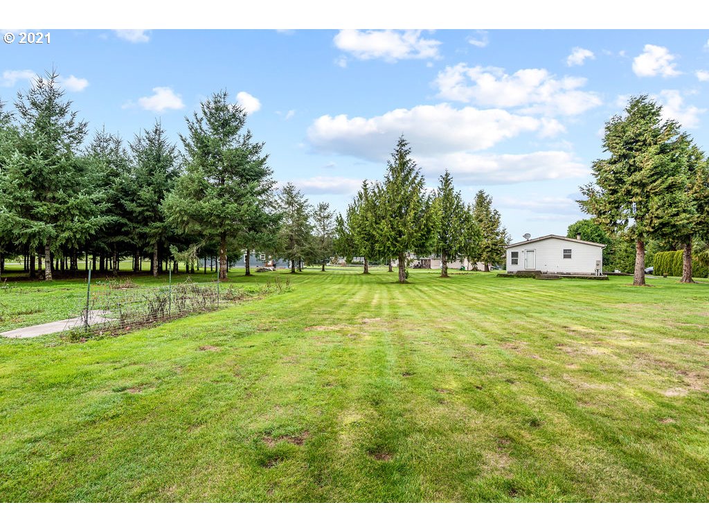 109 Highland Road Winlock, WA 98596 - Photo 10 of 28 a view of a golf course with a lake