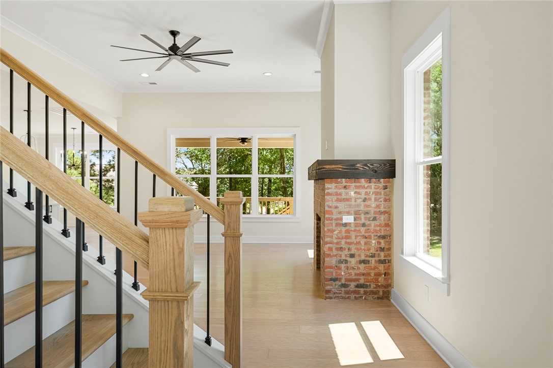 100 Garden Gate Drive Anderson, SC 29621 - Photo 3 of 43 This inviting interior features a warm fireplace and a grand staircase.