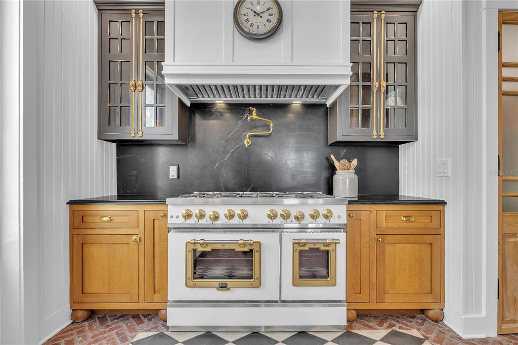 8241 Main Street Bokeelia, FL 33922 - Photo 40 of 100 a kitchen with a stove and cabinets