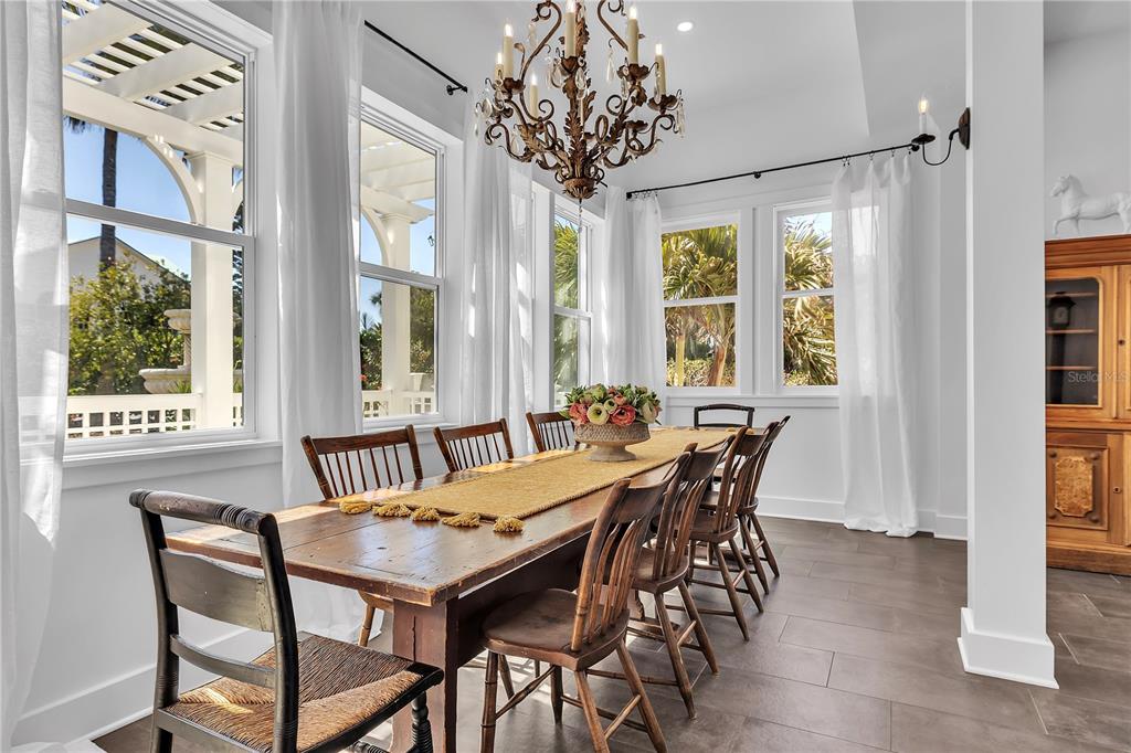 8241 Main Street Bokeelia, FL 33922 - Photo 46 of 100 a view of a dining room with furniture window and outside view