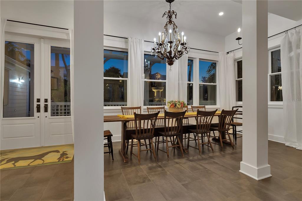 8241 Main Street Bokeelia, FL 33922 - Photo 47 of 100 a view of a dining room with furniture and chandelier