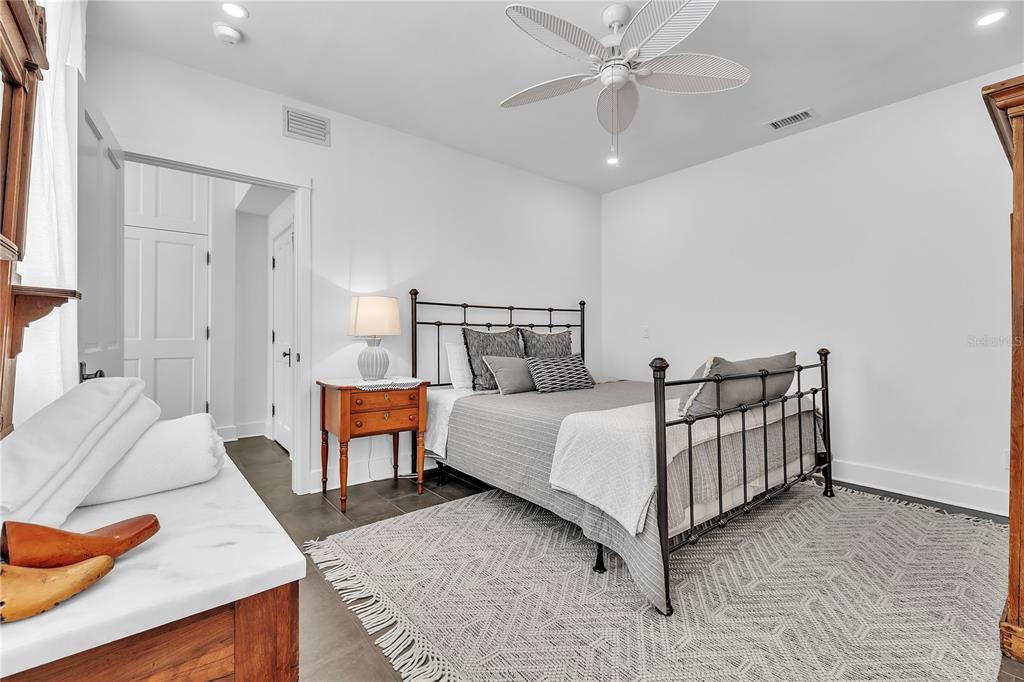 8241 Main Street Bokeelia, FL 33922 - Photo 50 of 100 a bed room with a bed and a couch