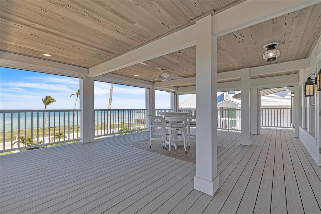 8241 Main Street Bokeelia, FL 33922 - Photo 8 of 100 a view of a balcony with wooden floor