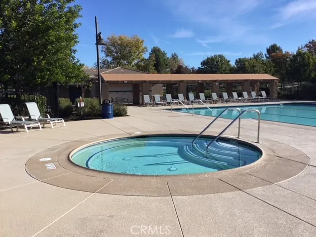 a view of a swimming pool with a patio